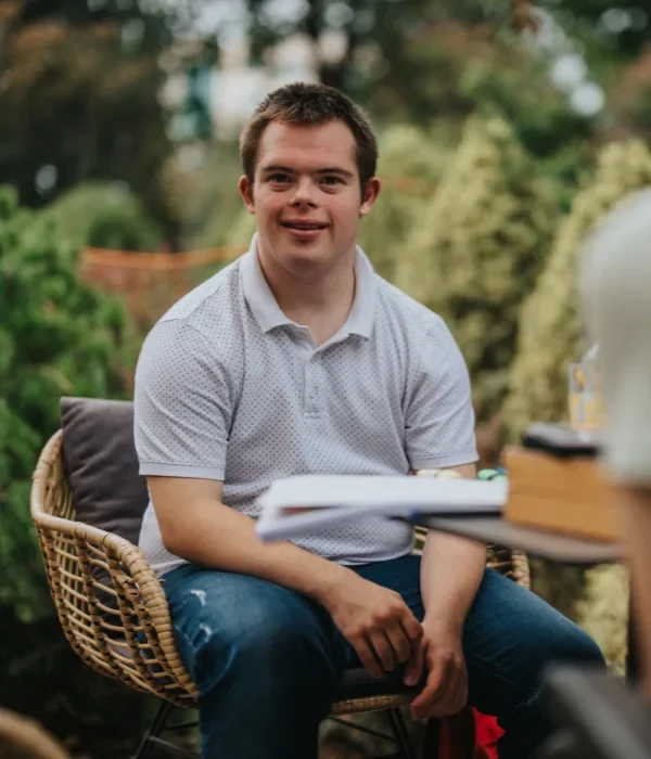 Disabled man with down syndrome smiling at the camera