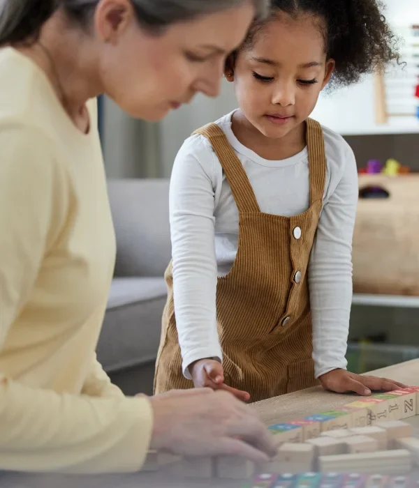 Young child with support worker during assessment